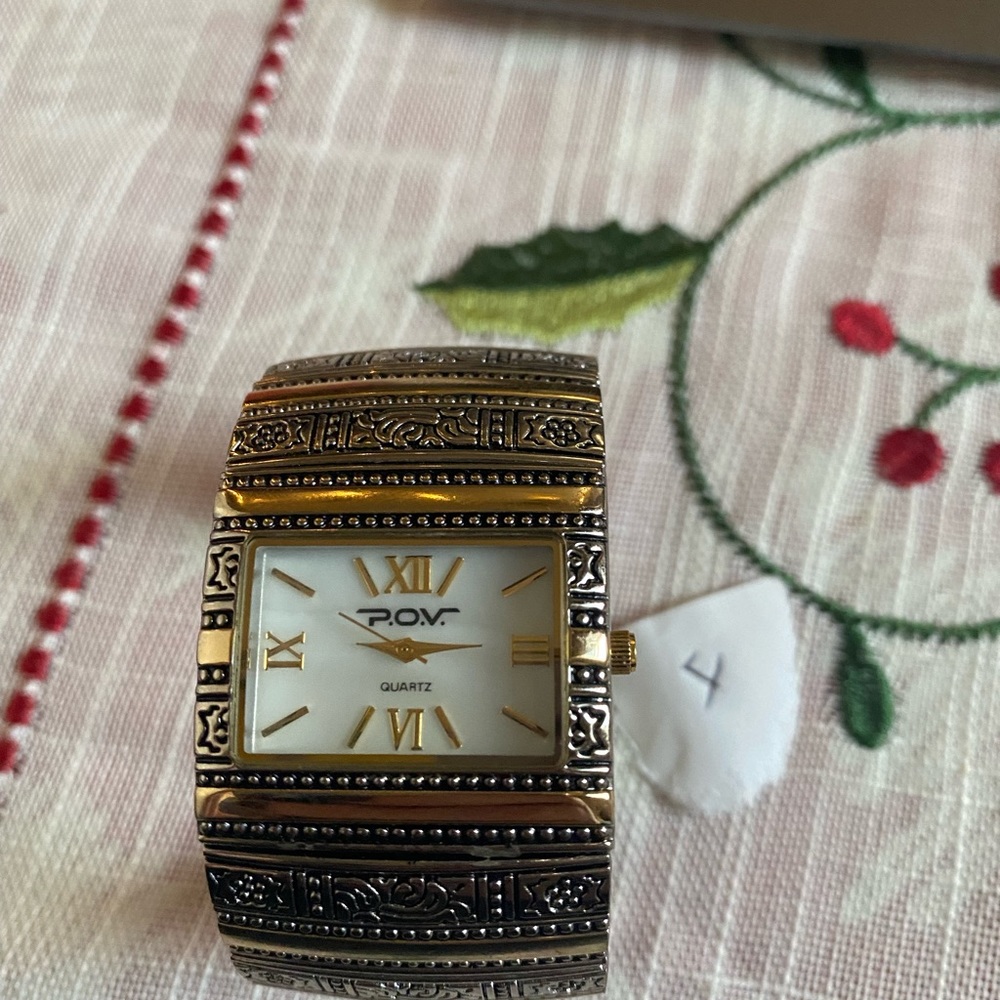 Vintage gold and silver tone POV ladies cuff bracelet watch.